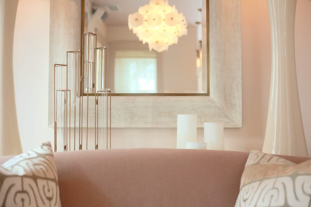 inside shot of ella ora skin clinic pink couch and mirror