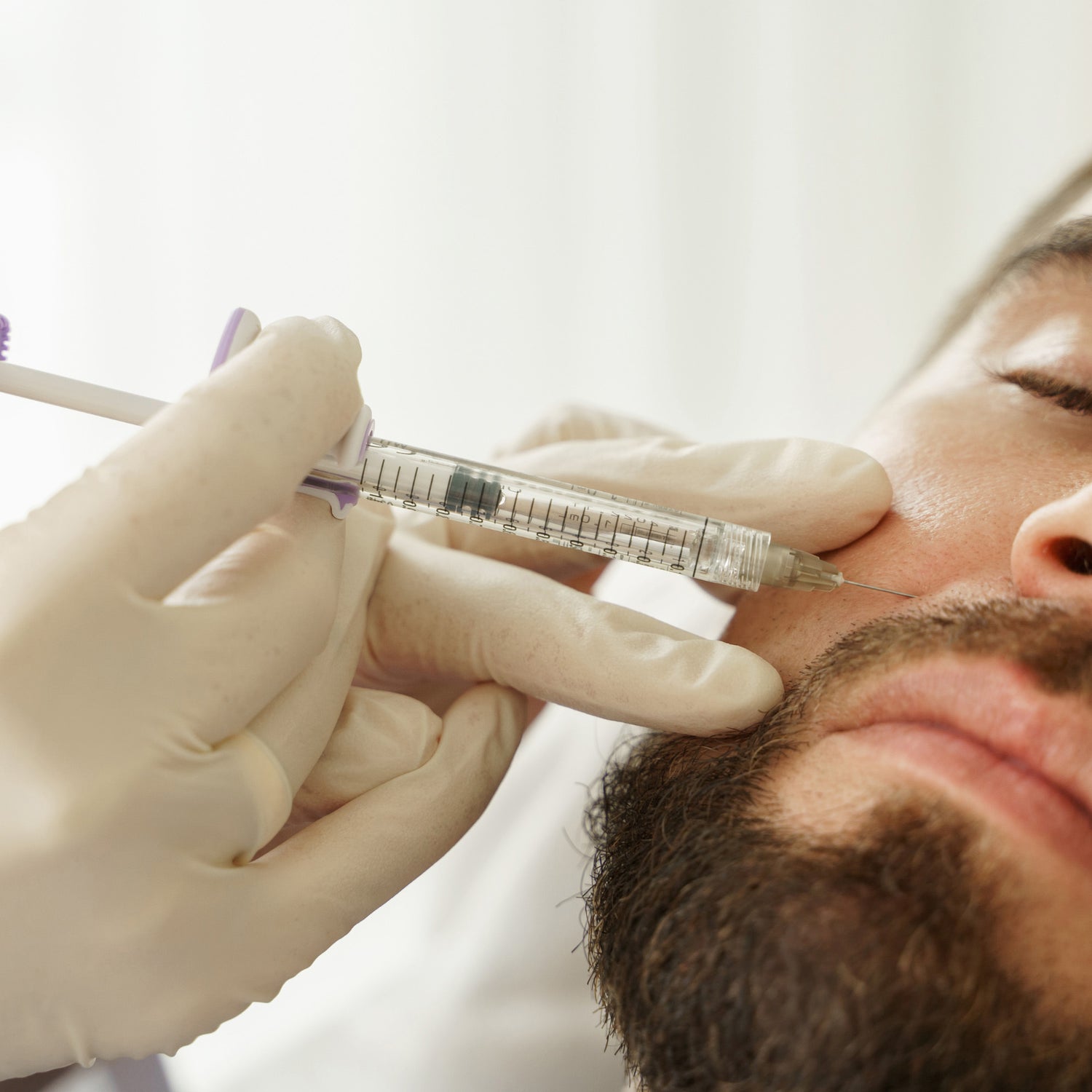 guy getting botox under his nose