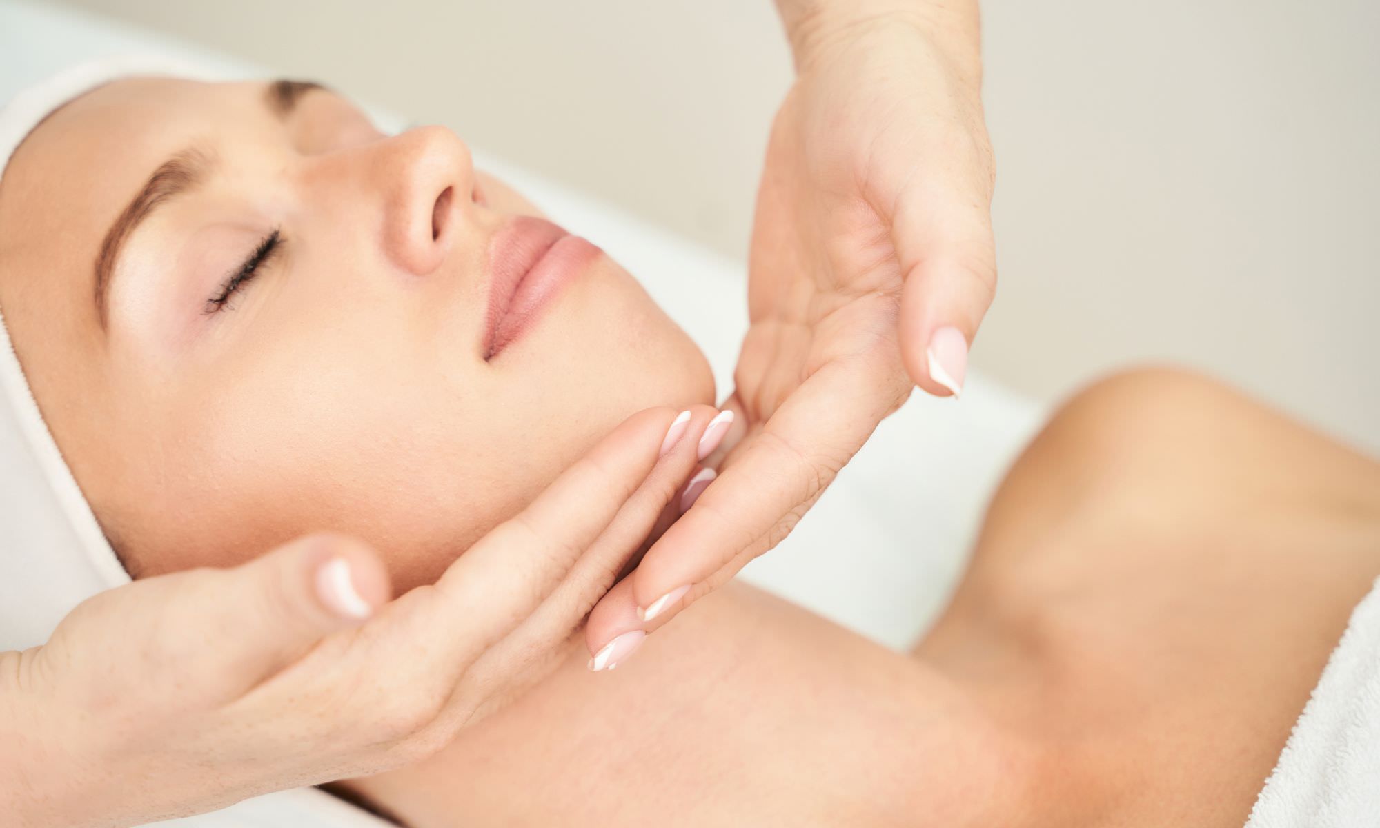 woman with beautiful skin getting a facial