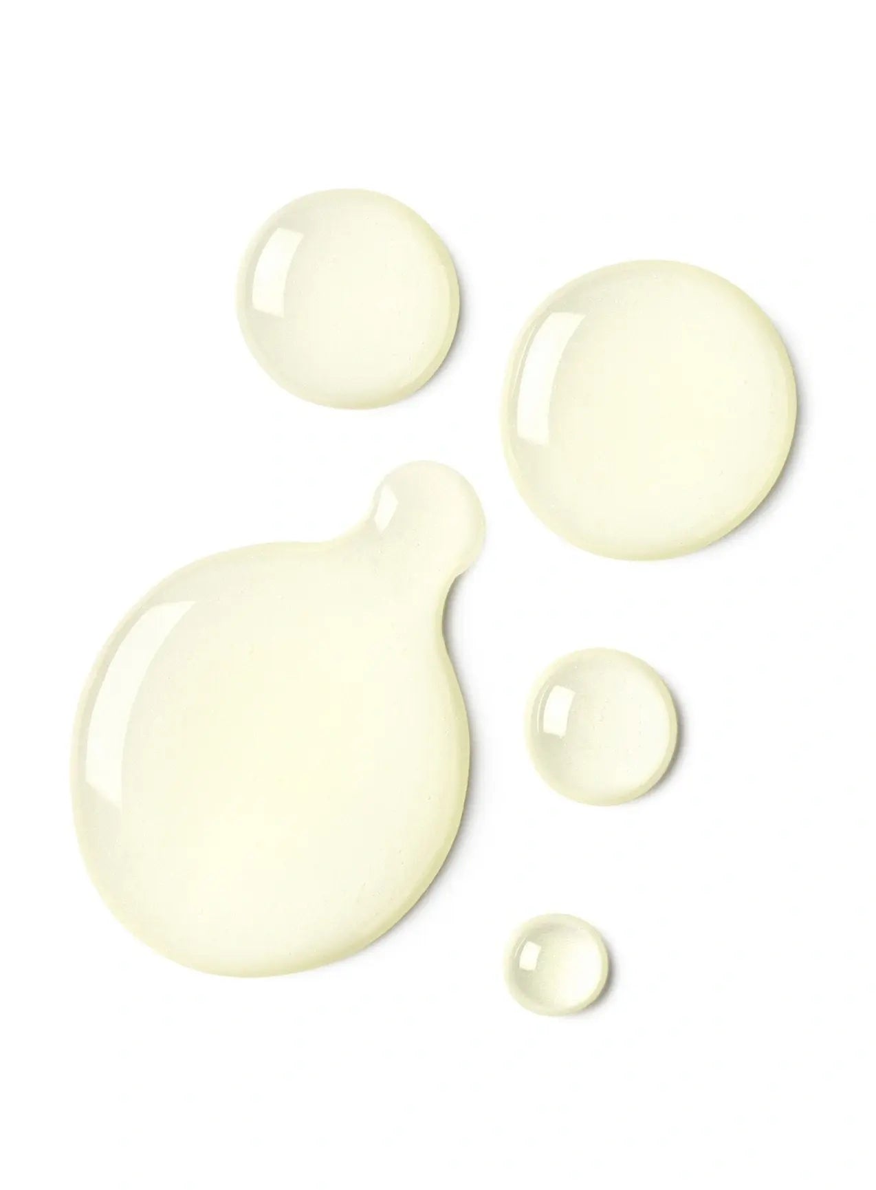 Supergoop Glow Oil SPF 50 drops on table