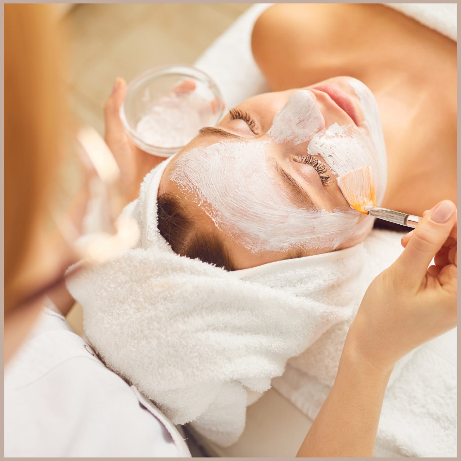 woman getting a facial at a salon