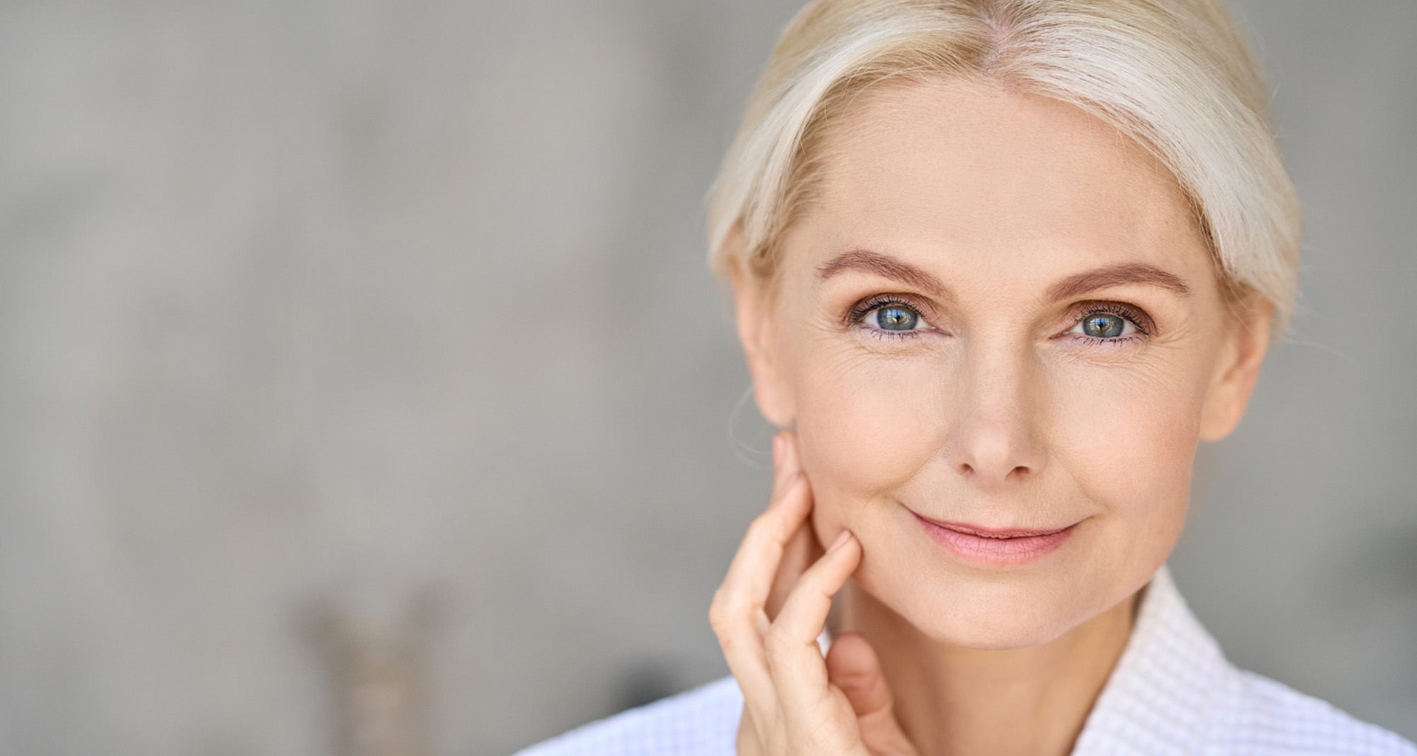 older beautiful woman smiling at camera