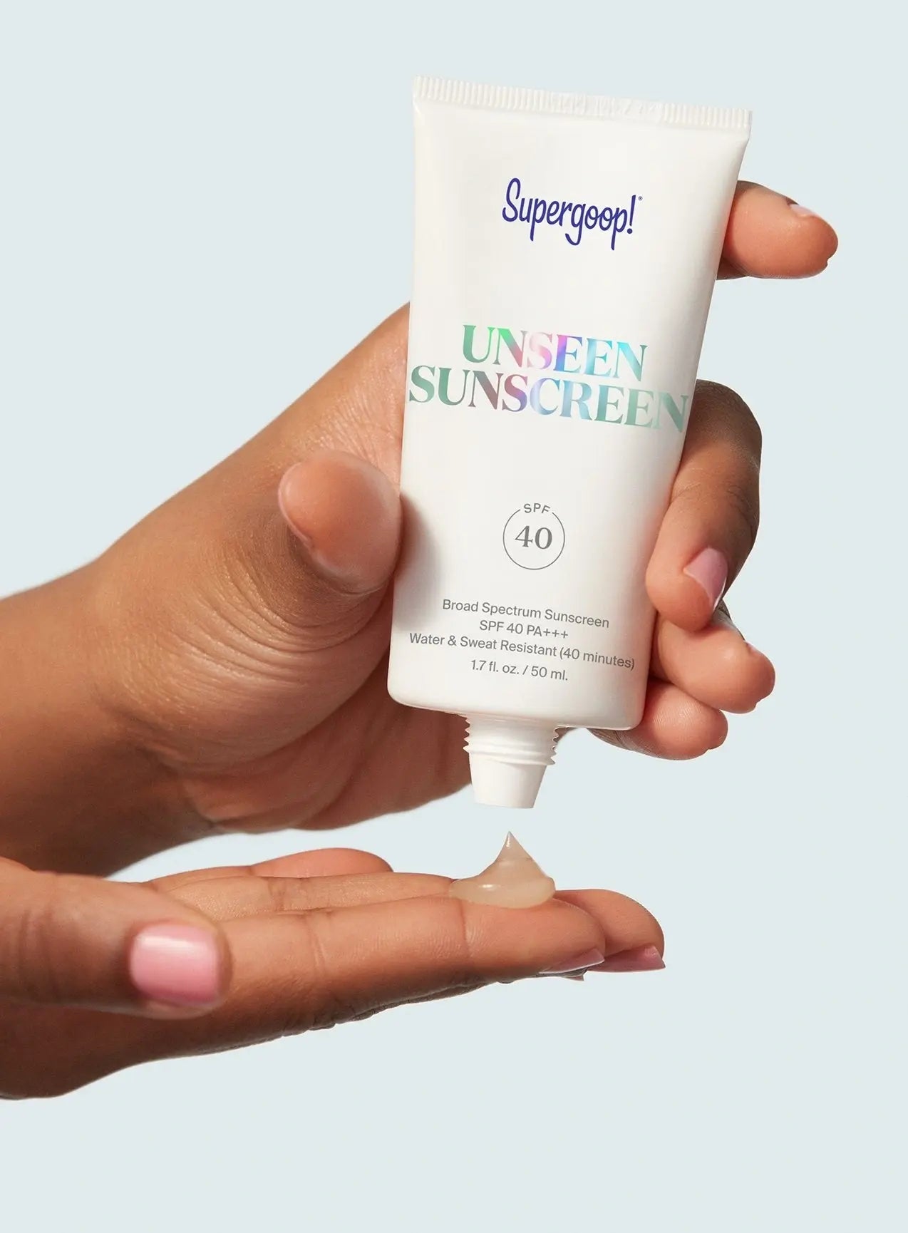 Supergoop Unseen Sunscreen SPF 40 being squeezed out on someone&